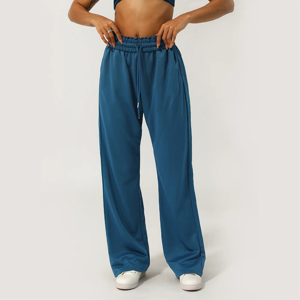 Calça Esportiva Feminina Cintura Alta com Bolso Lateral Perna Larga para Corrida Treino e Academia